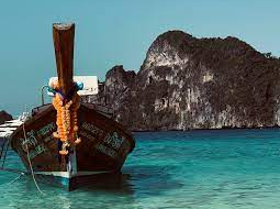 Phuket beach and boat on azure waters